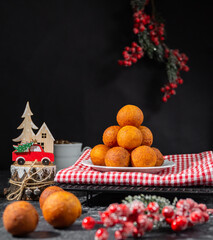 small balls of round doughnuts with christmas decorations