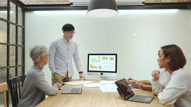 Businessman team leader proposing problem solution strategy to coworkers.