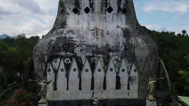 Gereja Ayam or Chicken Church surrounded by lush forest, Magelang in Indonesia. Religious tourism around Borobudur Temple,Drone video.