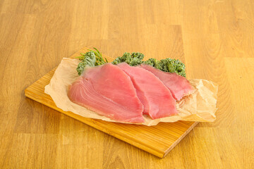 Raw salted tuna slice over board
