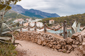 Obraz premium Love padlocks on a fence in Makarska city of Croatia on a cold winter day. Nobody around.