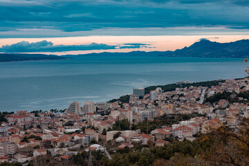 Panorama of the city of Makarska in Dalmatia, viewed from Biokovo mountain on a cold winter day. Picturesque views from above. Island of brac seen in the background.
