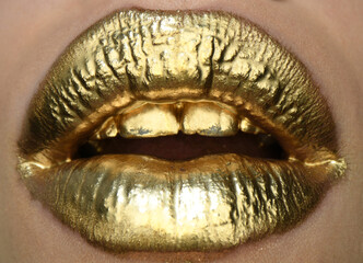 Sexy girl golden lips, gold mouth. Glowing gold skin make-up. Glitter metallic shine golden lipgloss makeup. Golden lip texture.