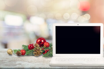Christmas shopping online concept. Laptop with gifts. Holiday winter sales, discounts, e-commerce