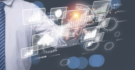 Analysts trading share strategy analyzing from diagram graph for investment to the future. Businessman touching screen at graph for analysis share for marketing growth business.