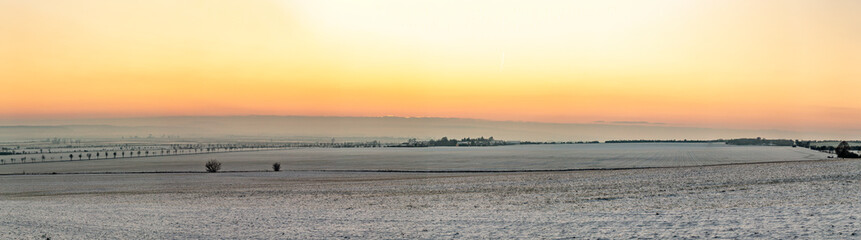 scenic sunrise in snow covered winter landscape in Thuringia