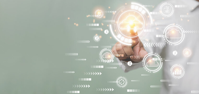 Businessman touching clouds computing on-screen network connection communication on virtual, technology, innovation, and business concept. Big database transfers use cloud computing.