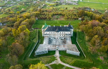 Aerial view of the ancient Ukrainian Pidhirtsi Castle. Location Pidhirtsi village, Lviv region, Ukraine, Europe. Popular European landmark. Photo from a drone. Discover the beauty of the land. Travel