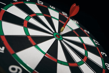 Concept achieving goal .Achieving goals in business and life.Dartboard with darts stuck right in...