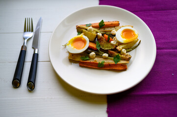 baked vegetables with egg and mayo on plate