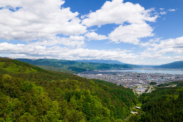 Fototapeta na wymiar 初夏の長野県岡谷市の上空から、空撮した諏訪湖