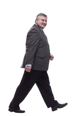 business man confidently striding forward . isolated on a white