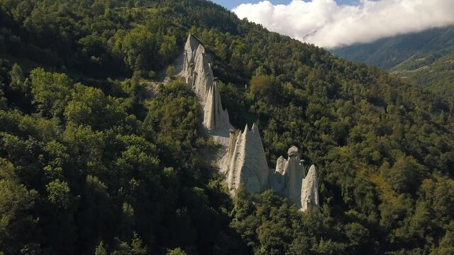 Rotating drone shot around the Pyramides of D'Euseigne at Val D'Herens in Switzerland in 4k.