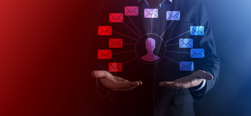Male hand holding letter icon,email icons .Contact us by newsletter email and protect your personal information from spam mail. Customer service call center contact us.Email marketing and newsletter