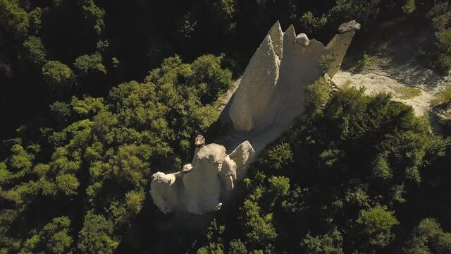 drone shot flying straight up looking down on the pyramides of D'Euseigne at Val D'Herens, Switzerland in 4k.