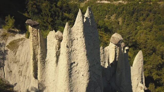 drone shot close up rotation around the Pyramides of D'Euseigne at Val D'Herens in Switzerland in 4k.