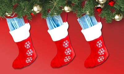 Christmas decoration with Coronavirus on a red background, Christmas socks, face masks. Covid concept