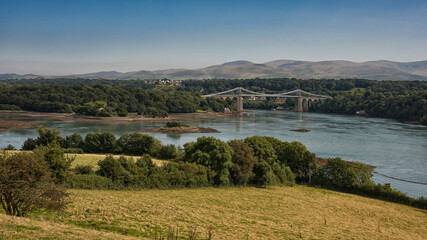 Fototapeta na wymiar The menai suspension bridge is a suspension bridge to carry road traffic between the island of Anglesey and the mainland of Wales.
