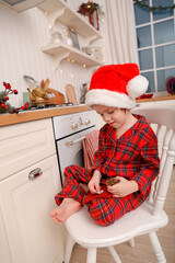 Obraz premium box with advent calendar green bag sits at modern white and wooden kitchen
