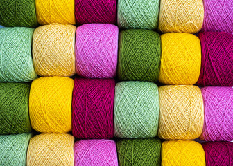 Close Up of yarn balls. Rainbow colors. Yarn for knitting. Skeins of yarn. Knitting needles, colorful threads. Knitting background, Knitting yarn for handmade winter clothes.