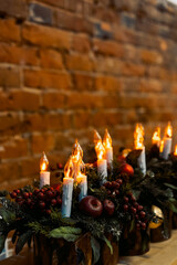 artificial candles on a brick wall background,