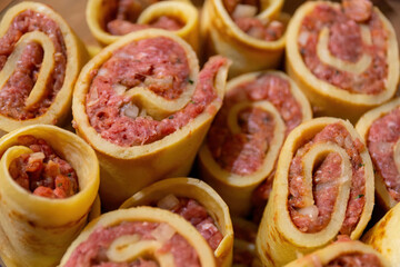 Full frame background with savory sausage rolls in close up