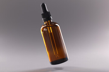 Glass bottle filled with oil liquid, flask with cosmetology product