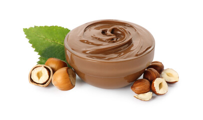 Glass bowl with tasty chocolate hazelnut spread and nuts on white background