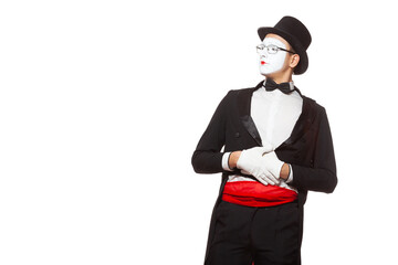 Portrait of a male mime artist performing, isolated on white background. Symbol of criticism, assessment, evaluates from the outside, excellence