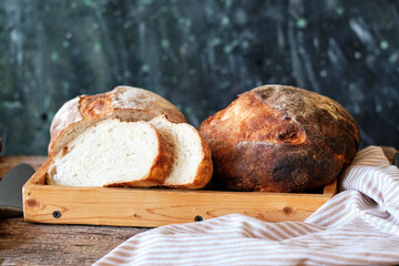 Homemade sourdough bread. Wooden background, side view, horizontal