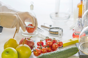 A food safety inspector checks vegetables and fruits from the market.
