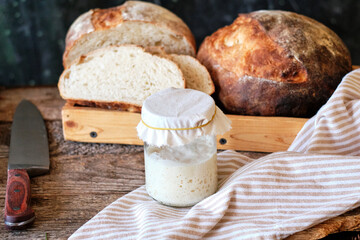 Bread sourdough in a glass jar. Side view, horizontal