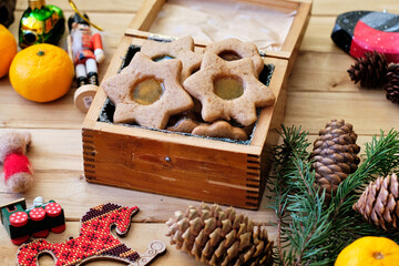 christmas linzer cookies with spices in a box