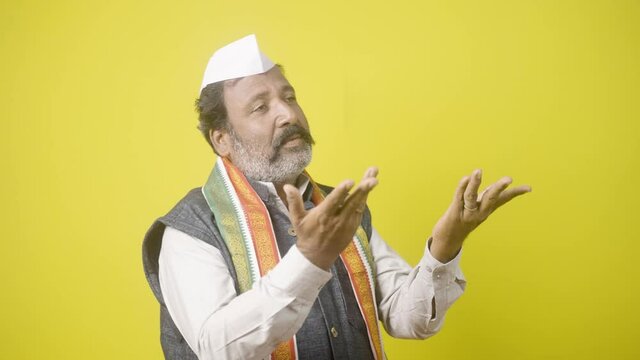 worried indian politician praying or apologizing god about future political carrer or free from criminal cases - concept of apologize, fear of scandle Investigation and poll or election results