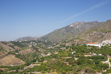 Fototapeta na wymiar The mountains behind Frigiliana, seen from the entrance of the village