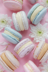 Beautiful colorful tasty macaroons on a pink  background
