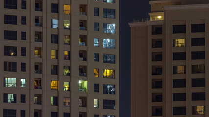 Night view of exterior apartment colorful buildings timelapse with windows