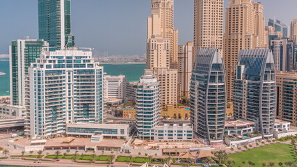 Dubai Marina skyscrapers and JBR district with luxury buildings and resorts aerial timelapse