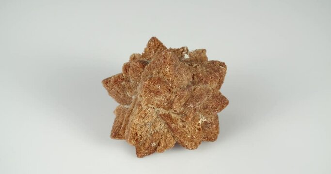 Rotation of glendonite on a white background.
