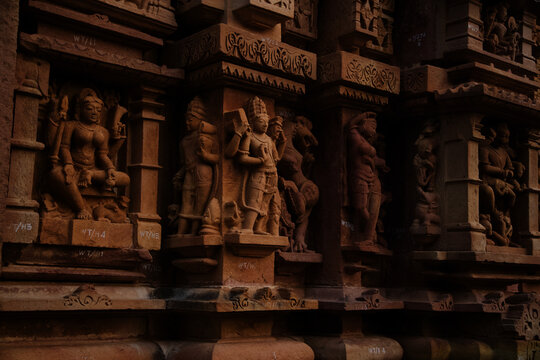 Closeup shot of a wall with many sculptures of a Lakshmana Temple in Khajuraho, India