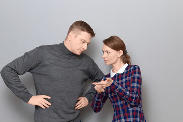 Portrait of man and woman talking and arguing, relationship concept