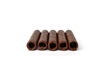 Waffle rolls coated chocolate isolated on white background.