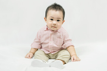 Fototapeta premium Stylish fashionable kid. Toddler baby boy model in casual clothes.Adorable asian