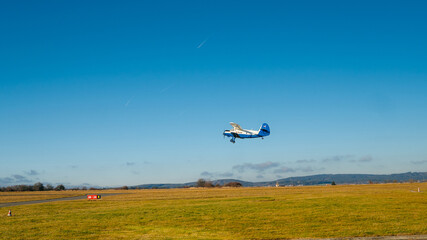 Fototapeta na wymiar Skyranger Nynja, red airplane on the runway in Pribram airport. Czech Republic. Single-engine turboprop blue airplane. Blue Airplane on runway.