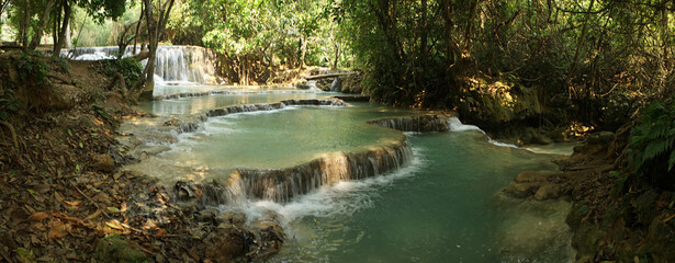 Kuang Si Waterfall and pools in tropical rain forest in Laos.