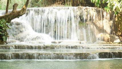 Kuang Si Waterfall and pools in tropical rain forest in Laos.
