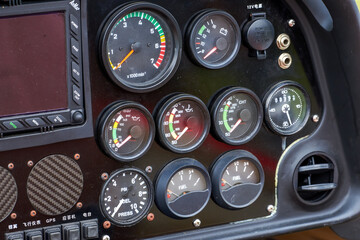 A close-up of the internal dashboard panel of a small aircraft