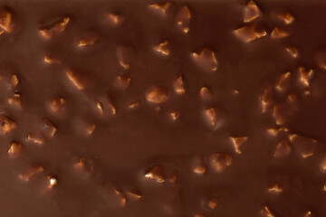 Chocolate bar with nuts background or texture.