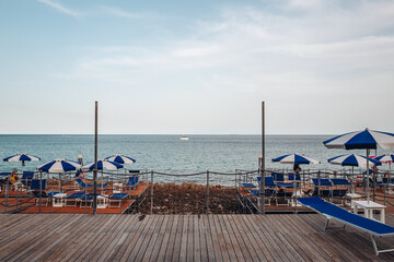 Naklejka premium Santa Maria di Leuca, Italy-June 2021: deck chairs on the beautiful coastiline in the southern part of Puglia