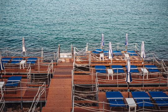 Santa Maria di Leuca, Italy-June 2021: deck chairs on the beautiful coastiline in the southern part of Puglia
